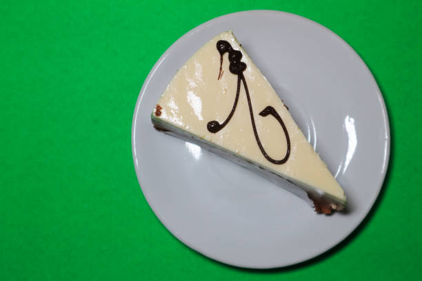 istock Fresh Cheesecake Mousse Slices on a Green Background 1976637777