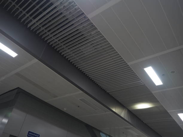 istock Gray-black and indigo silver ceiling and white-yellow lighting. 1976643004