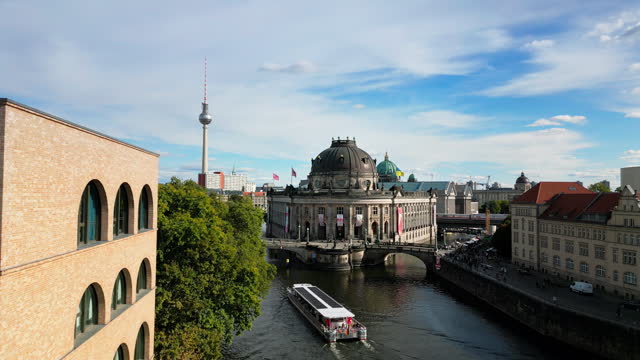 4K Aerial view Real time Footage of Berlin Bode museum with Monbijou Bridge over spree river and Berlin Cathedral and Television tower or TV tower at Alexanderplatz in Berlin, Germany