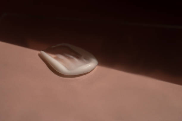 istock A smear of cream on a light background. Beauty concept. 1976690304