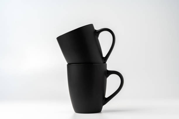 istock Black coffee mugs mock up on white background copy space 1976719443