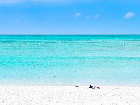 Turquoise blue waters and white sand sandy beach in Taketomi island Okinawa