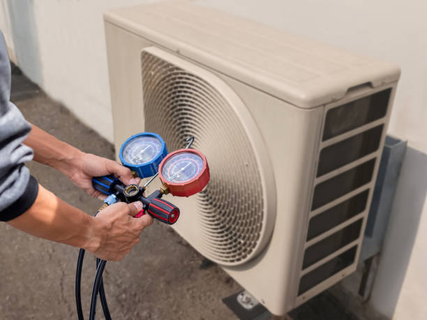 istock Air conditioning, HVAC service technician using gauges to check refrigerant and add refrigerant. 1976738727
