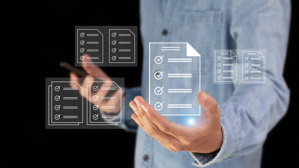 istock Businessman checks digital checklist documents in hand technology about paperless digital document operation, document control and management concept. 1976738728