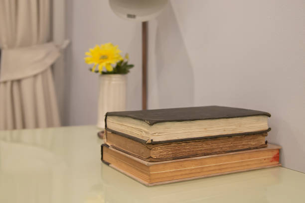 istock Old books stacked on the table 1976741816