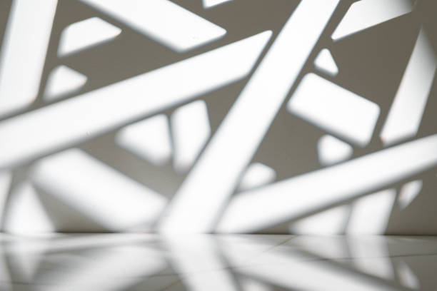 Abstract geometric gray shadow background on the white wall