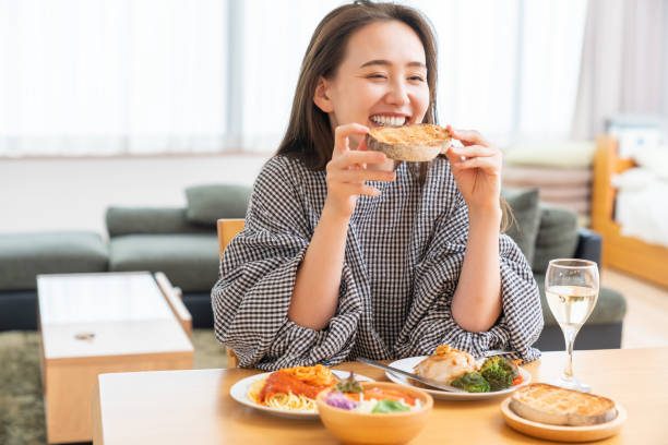 istock asian woman who eats 1976769535