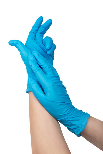 istock Doctor wearing blue nitrile gloves isolated on white background 1976769538