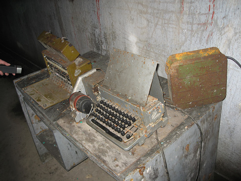 Old obsolete analog communication and encryption military equipment discovered in abandoned underground bunker in Vladivostok fortress, Russia