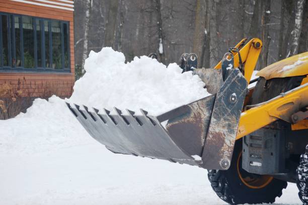 removing snow with an excavator