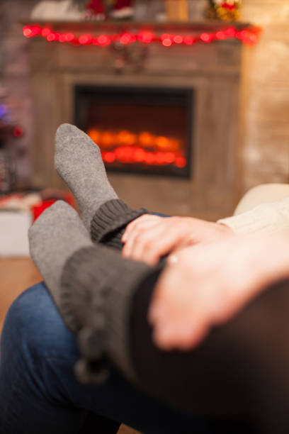 istock Boyfriend holding his hands on his girlfriend feet 1976872020
