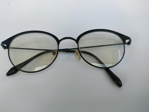 Close-up of stylish eyeglasses with plastic frame, optical store advertising. Glasses selection or eye test and vision examination at optician concept