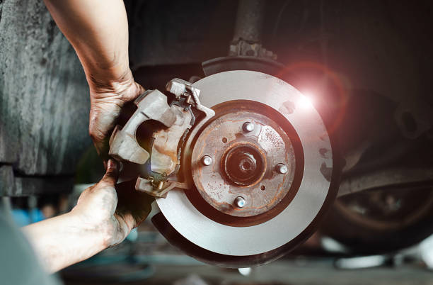 istock Mechanic Repairing Car Brake System 1976886712