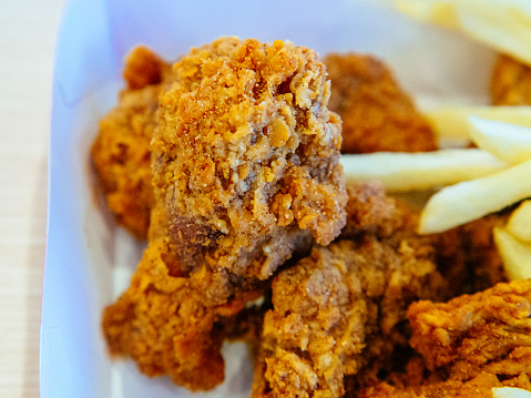 Fried Chicken strips with ketchup on white wooden board. Fast Food.