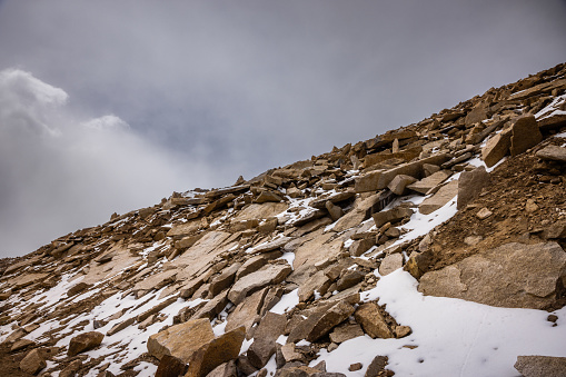 Massive rocks on the mountain slopes at Warila pass in between peaks of the greater Himalayas, en route Leh, Ladakh