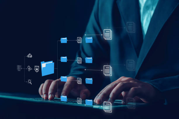 istock Businessman manages files, data, folders, sharing, digital, 1976892732