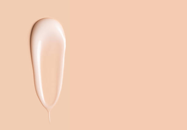 istock cosmetic smear texture on pastel beige background 1976893295