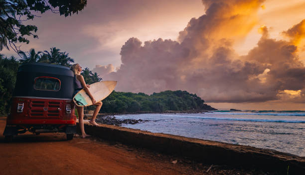 istock Surfing in a tropical island 1976916505
