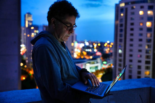 istock Man with Laptop at Night 1976944935