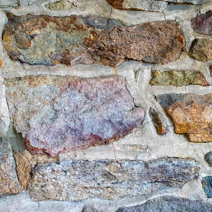 Colorful stones with rough texture in beautiful colonial american wall Pennsylvania home. great background