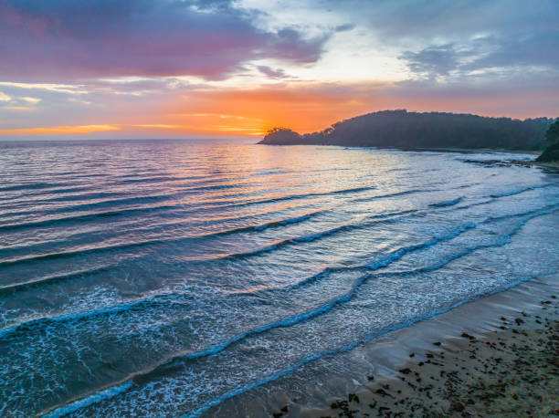 istock Summer Sunrise Seascape with Rain Clouds 1976985438