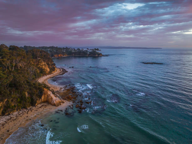 istock Summer Sunrise Seascape with Rain Clouds 1976987562