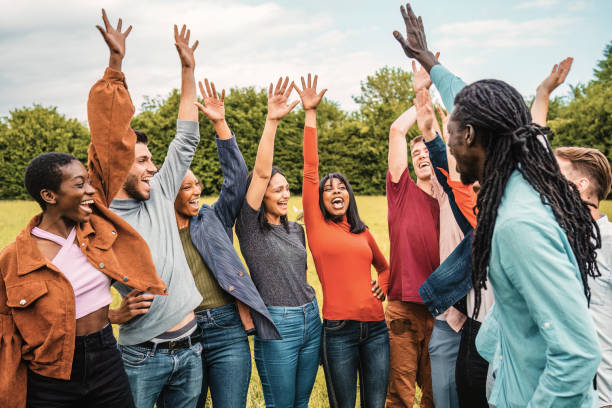 istock Joyful Friends Celebrating in the Park 1976990232