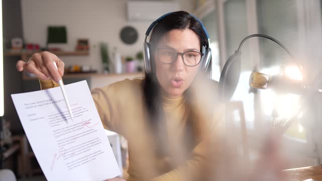 Mid adult woman recording online classes for her podcast channel