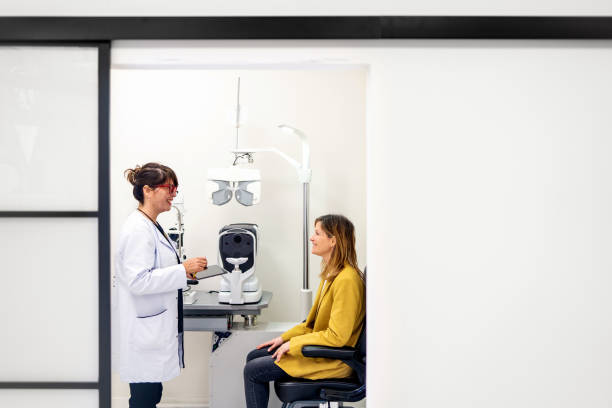 istock Optometrist talking to a patient in a clinic 1977013437