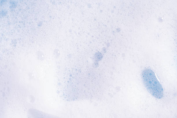istock Foam texture background. Soap, shampoo, mousse, shower gel foam, soap suds. 1977022863