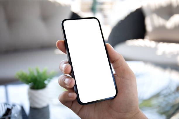 istock Male hands hold phone isolated screen in cafe in office 1977030703