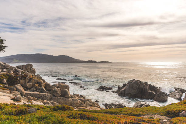 istock White waves hitting rocks on the ocean shore 1977050804