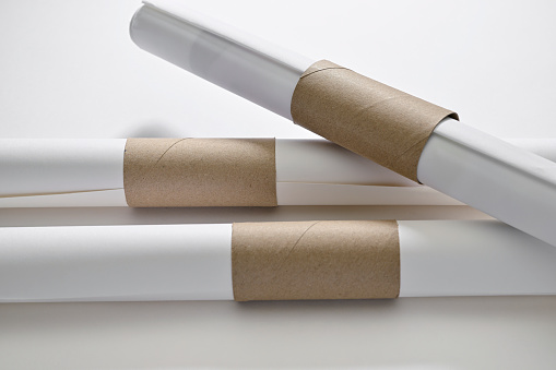 Lifehacks; keep the papers from unrolling with a toilet paper tube slit lengthwise down the middle