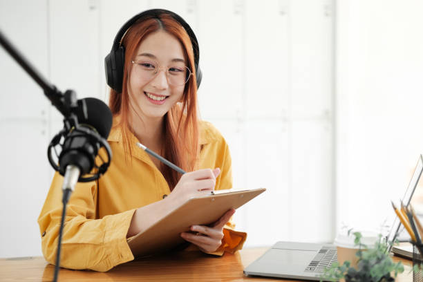 istock Live Podcast Session with Smiling Female Host 1977054432