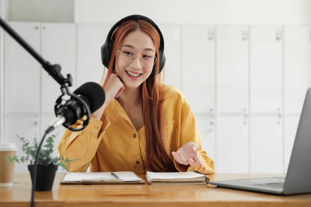 istock Live Podcast Session with Smiling Female Host 1977054527