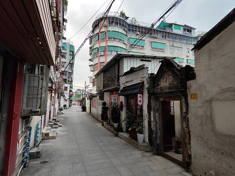 Narrow alley with traditional houses and old residential building in Chaozhou City centre. Chaozhou is a cultural center of the Chaoshan region in Guangdong province.