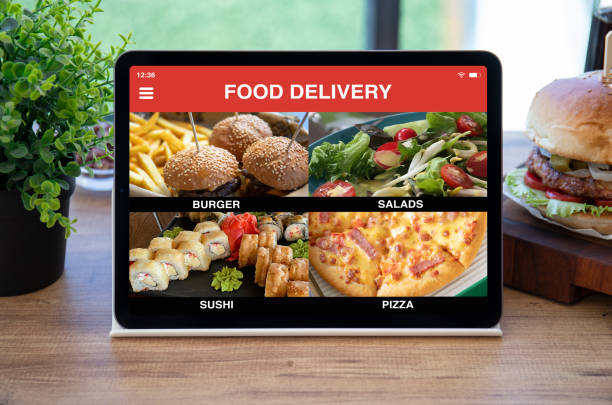 istock computer tablet with app food delivery on screen in cafe 1977062141