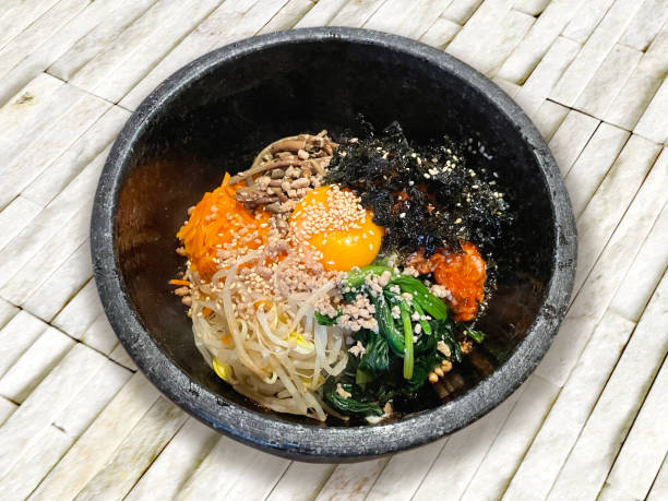 istock Stone-grilled bibimbap (Korean food) served on a tray on the table 1977074128