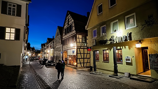 Tübingen, Germany - January, 28th - 2024:  typical alley in the old town at night.