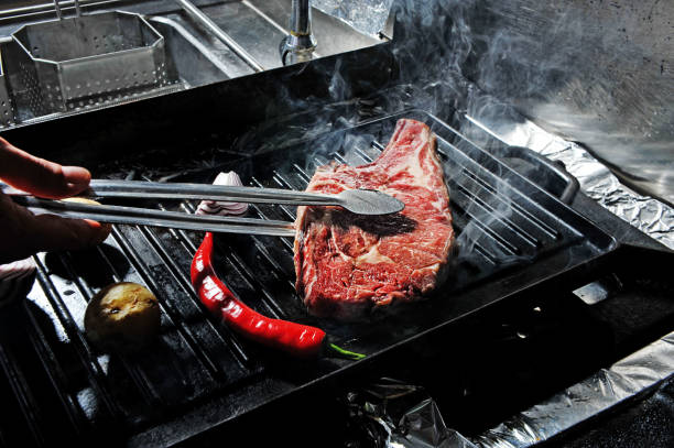 Grilled Meat Meat cooking on the grill with red pepper and onion hhh stock pictures, royalty-free photos & images