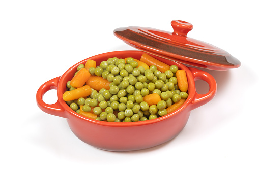 dish of peas and carrots, close-up, isolated on a white background