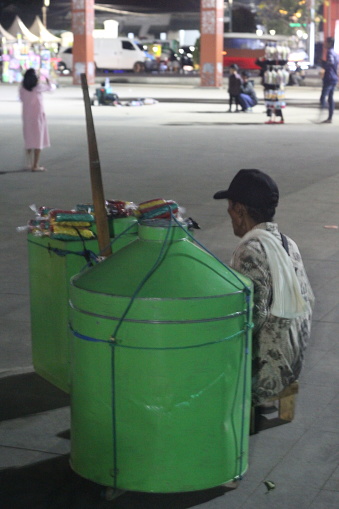 Sumedang, West Java - October 28, 2023 : was selling cans of crackers in the square