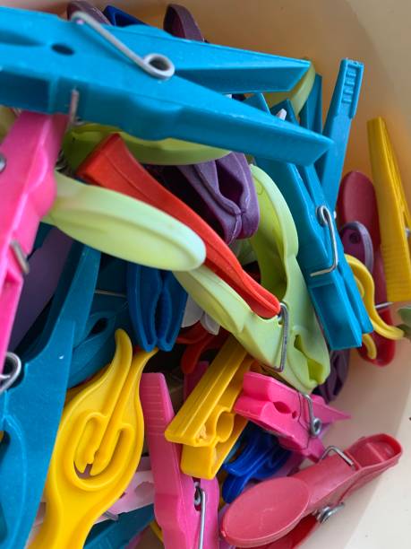 istock Container full of Plastic clothes pegs used for laundry 1977105091