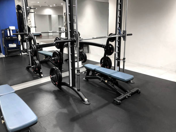 istock Fitness gym bench press equipment (Smith machine) 1977116239