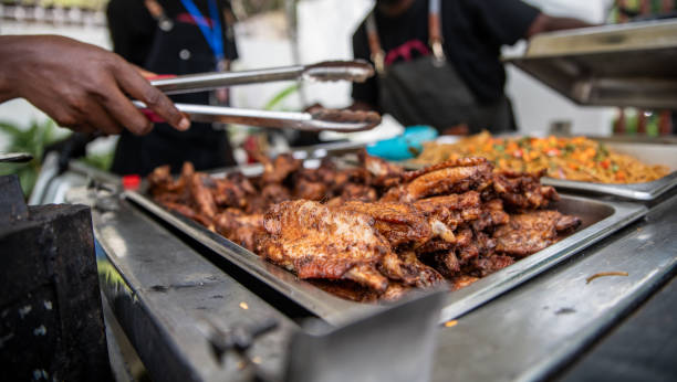istock Grilled chicken being served at a party 1977119944