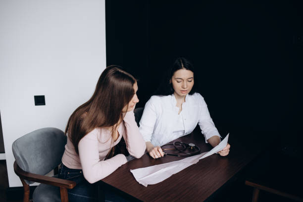 istock Beautiful young woman dressed in a terry bathrobe having a consultation 1977123680