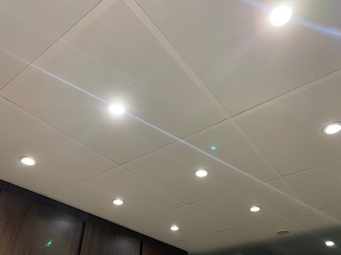 Suspended ceiling with spotlights, taken indoors