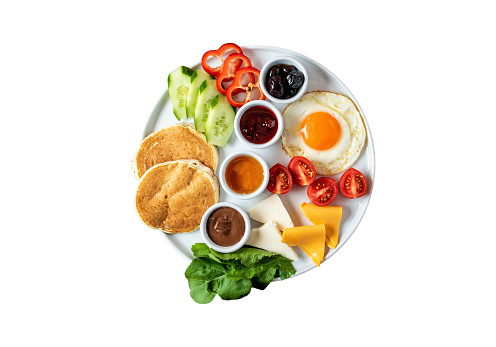 Huge healthy breakfast spread on white background with coffee, tea, tomato, egg, pancake, jam and cheese,