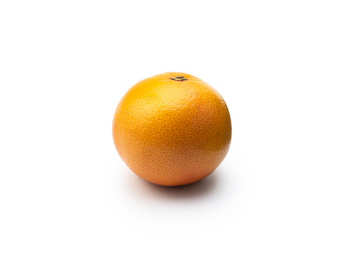 Whole grapefruit isolated on white, studio shot.