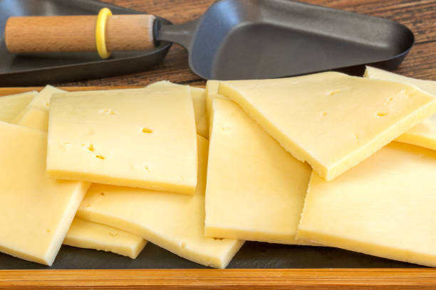 istock slices of raclette cheese, close-up, on a table 1977150167